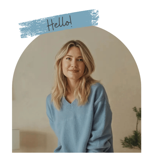Smiling woman in a blue sweater with 'Hello!' text, against a neutral background. Cozy and welcoming vibe.